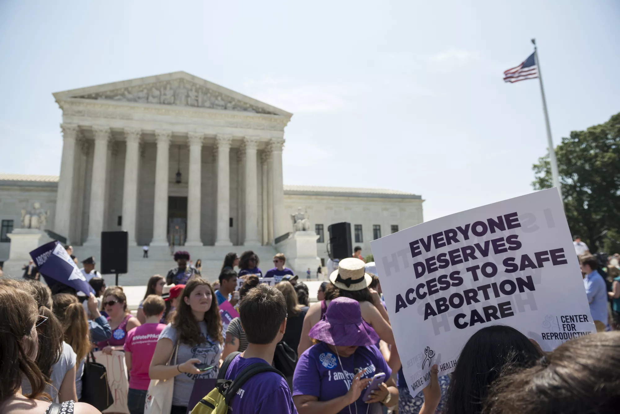 Washington DC, USA - June 27, 2016: Pro-choice supporters stand in front of the U.S. Supreme Court after the court, in a 5-3 ruling in the case Whole Woman's Health v. Hellerstedt, struck down a restrictive Texas abortion access law.